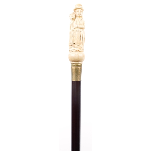 1377 - Hardwood walking stick with erotic carved bone handle, 90cm in length