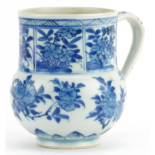 330 - Chinese blue and white porcelain handled cup hand painted with flowers, 11.5cm high