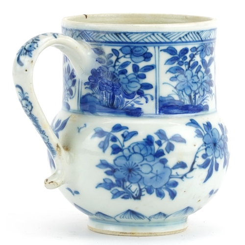 330 - Chinese blue and white porcelain handled cup hand painted with flowers, 11.5cm high