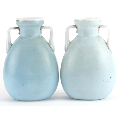 102 - Pair of 19th century opaline glass vases with twin handles, each hand painted with flowers, 17cm hig... 