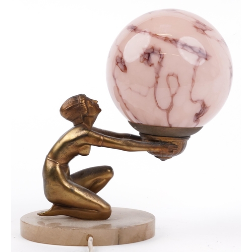 31 - Art Deco gilt metal figural table lamp in the form of a nude female with globular pink glass shade, ... 