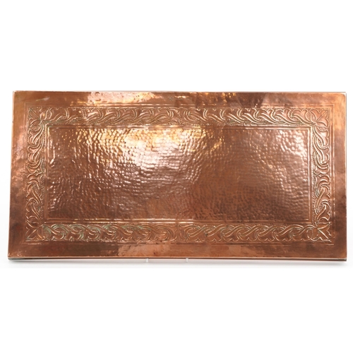 160 - Keswick, Arts & Crafts beaten copper train engraved with stylised foliage, impressed marks to the re... 