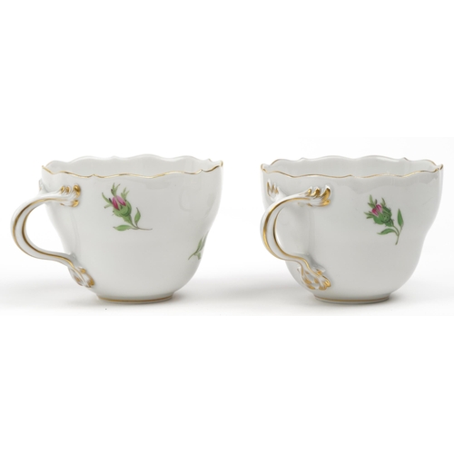 177 - Meissen, German porcelain hand painted with roses comprising two cups with saucers and plate, blue c... 