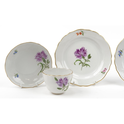 96 - Meissen, German porcelain hand painted with flowers comprising two cups with saucers and two side pl... 