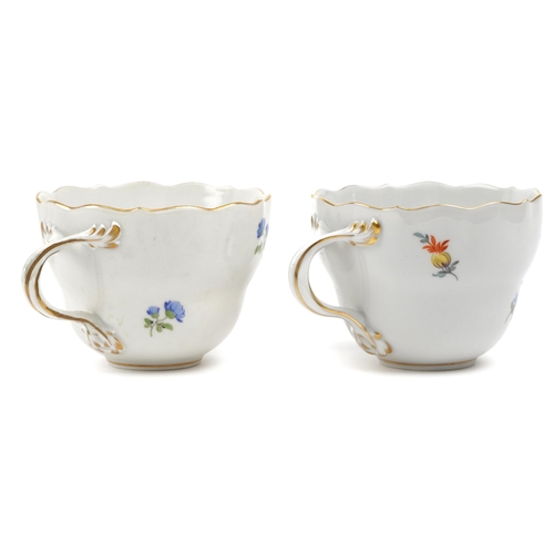 96 - Meissen, German porcelain hand painted with flowers comprising two cups with saucers and two side pl... 