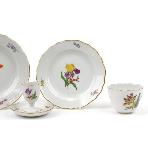 179 - Meissen, German porcelain hand painted with flowers comprising cup, two plates, milk jug and eggcup,... 