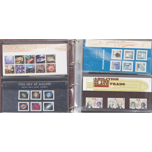 767 - Collection of Royal Mint presentation packs arranged in two albums, various genres and denominations