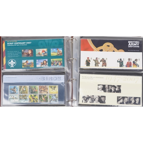 767 - Collection of Royal Mint presentation packs arranged in two albums, various genres and denominations