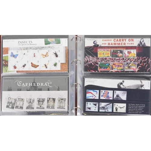 767 - Collection of Royal Mint presentation packs arranged in two albums, various genres and denominations