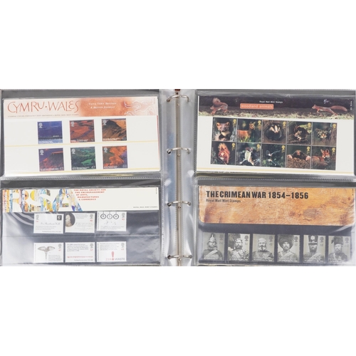 766 - Collection of Royal Mint presentation packs arranged in three albums, various genres and denominatio... 