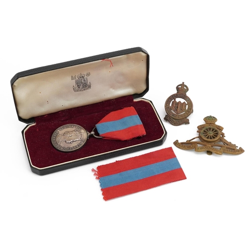 824 - Elizabeth II Faithful Service medal and two cap badges, the Faithful Service medal awarded to Willia... 