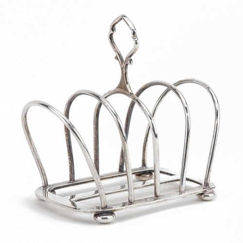 85 - Hukin & Heath, Art Deco silver four slice toast rack in the manner of Christopher Dresser, retailed ... 