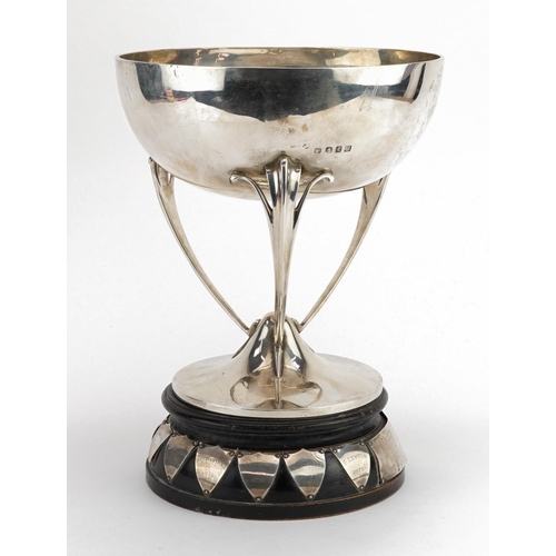 32 - Lawson & Co, large Scottish Arts & Crafts horticultural interest silver trophy raised on an ebonised... 