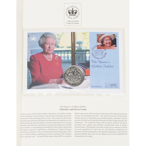 769 - The Queen's Golden Jubilee coin covers arranged in two albums including Isle of Man cover and Gibral... 