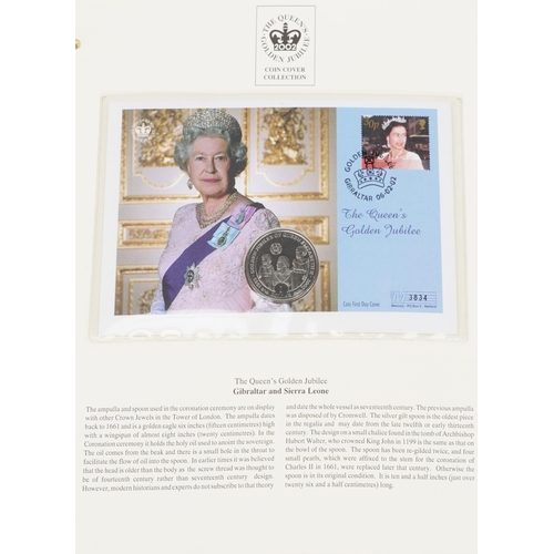 769 - The Queen's Golden Jubilee coin covers arranged in two albums including Isle of Man cover and Gibral... 