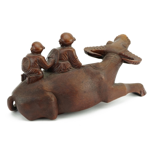 333 - Large Chinese hardwood carving of two boys on water buffalo, 35cm in length