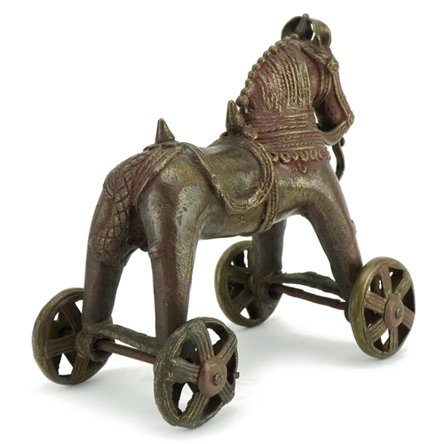 1492 - Chinese patinated bronze push along horse, 18cm high