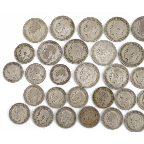 634 - Collection of George V pre 1947 British florins and shillings, 269.0g