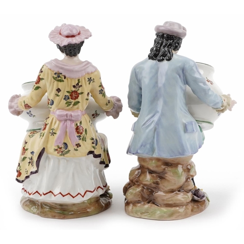 181 - Manner of Sevres, pair of continental porcelain figures, each holding a bowl, the largest 30cm high