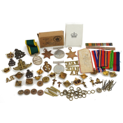 812 - British military World War I and later militaria including George VI Territorial Efficient Service m... 