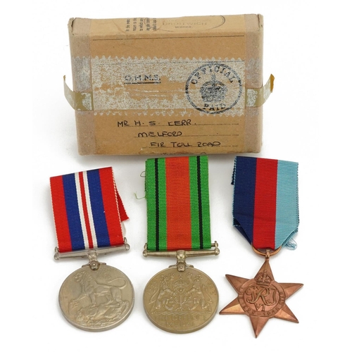 806 - Three British military World War II medals with box of issue inscribed Mr H S Kerr