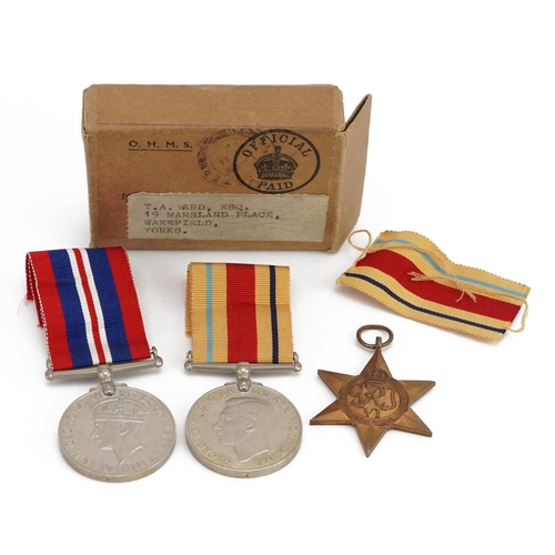 813 - Three British military World War II medals with box issue inscribed T A Ward Esq