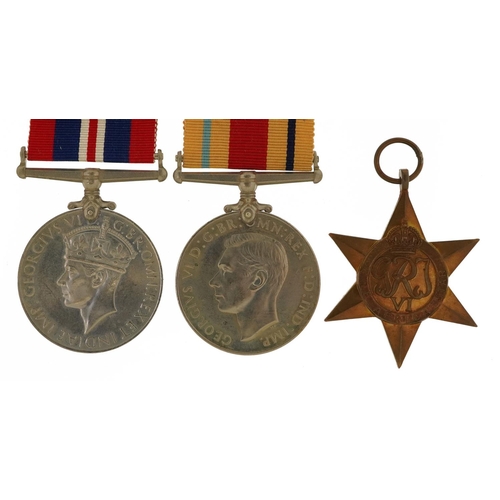 813 - Three British military World War II medals with box issue inscribed T A Ward Esq