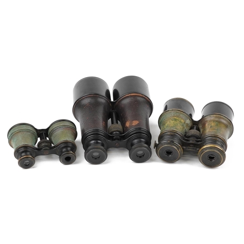 860 - Three pairs of vintage binoculars with cases including marine, field and theatre examples