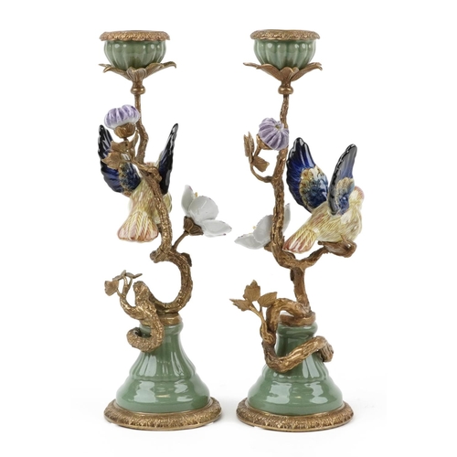 45 - Pair of antique style porcelain and bronze candlesticks in the form of a birds on branches with flow... 
