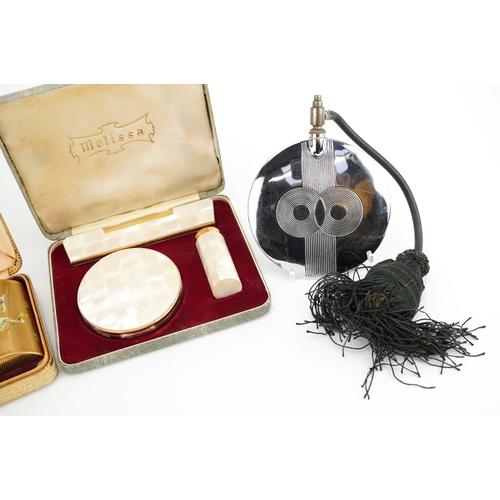 393 - Vanity items including Art Deco atomiser, Kigu three piece set with case and Melissa mother of pearl... 