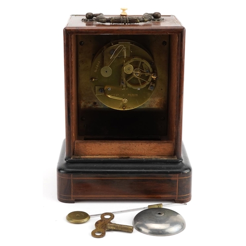 10 - French inlaid rosewood travel clock striking on a bell with silvered dial having Roman numerals insc... 