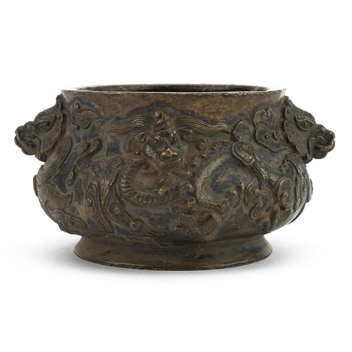 74 - Chinese bronze censer with twin animalia handles cast in relief with dragons, six figure character m... 