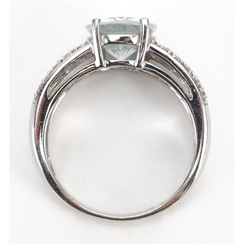 2133 - 9ct white gold aquamarine ring with pierced diamond set shoulders, the aquamarine approximately 10.1... 