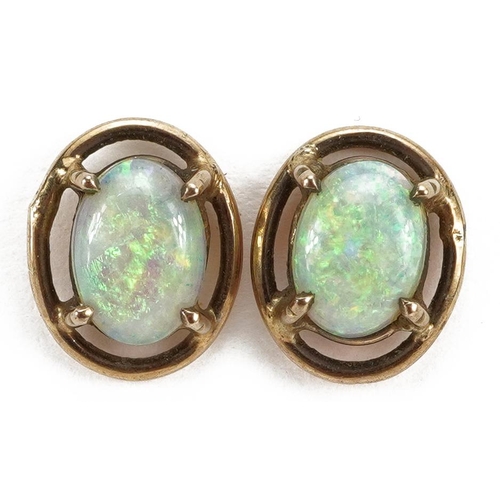 2126 - Pair of unmarked gold cabochon opal stud earrings, 1.0cm high, 1.1g