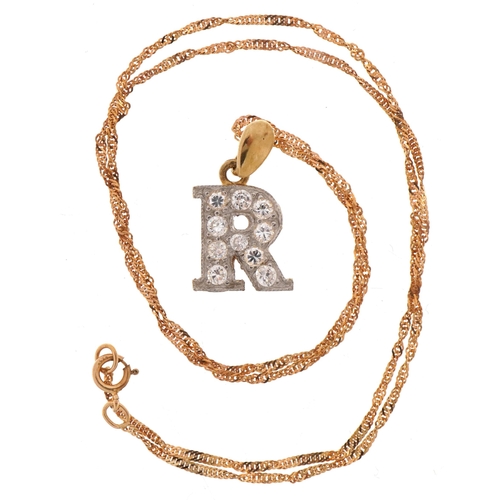 2120 - 9ct gold cubic zirconia initial R pendant on 9ct gold rope twist necklace, 2.1cm high, 40cm in lengt... 