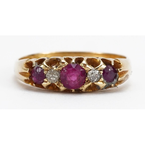 2039 - 18ct gold ruby and diamond five stone ring, the largest ruby approximately 3.7mm in diameter, indist... 