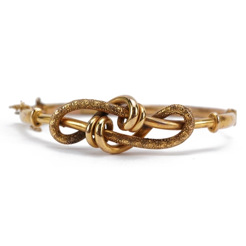 2047 - Victorian 9ct gold knot design bangle with safety chain, 6.2cm wide, 7.7g