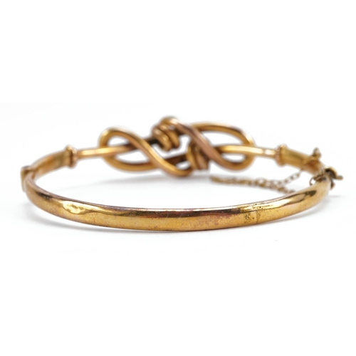 2047 - Victorian 9ct gold knot design bangle with safety chain, 6.2cm wide, 7.7g