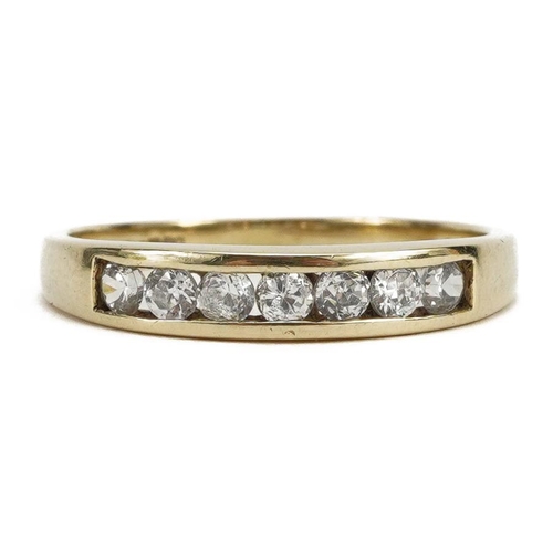 2163 - 9ct gold cubic zirconia seven stone ring, size M, 1.6g