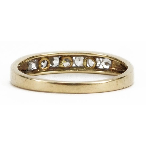2163 - 9ct gold cubic zirconia seven stone ring, size M, 1.6g