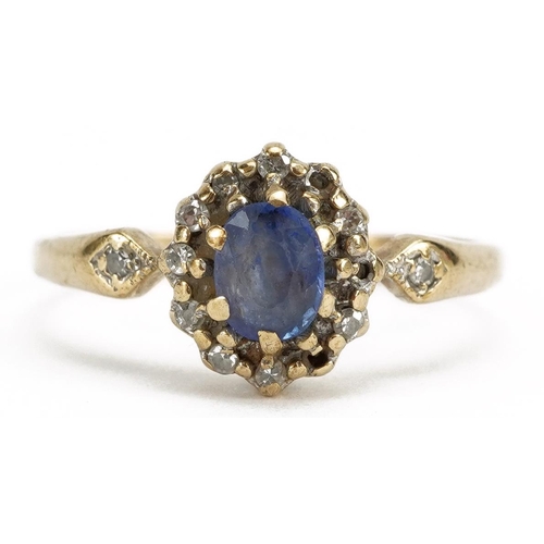 2144 - Unmarked gold sapphire and diamond cluster ring with diamond set shoulders, the sapphire approximate... 