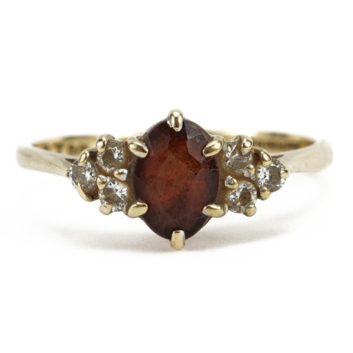 2147 - 9ct gold red stone and cubic zirconia ring, size O, 1.8g