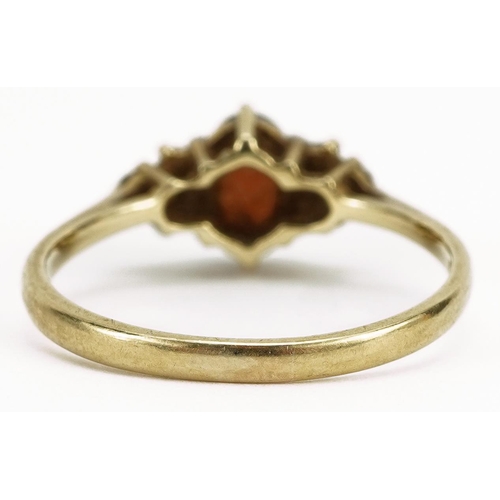 2147 - 9ct gold red stone and cubic zirconia ring, size O, 1.8g