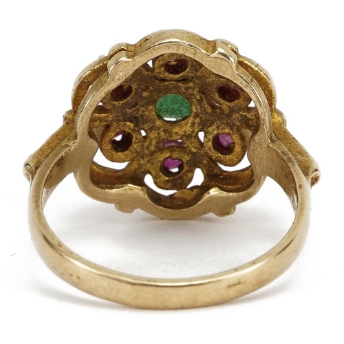 2049 - 9ct gold emerald and ruby flower head ring, the emerald approximately 4.9mm in diameter, size O, 4.6... 