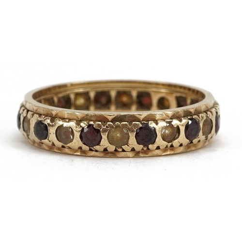 2148 - 9ct gold garnet and clear stone eternity ring, size P, 2.9g