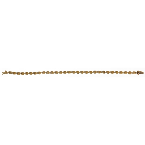 2116 - 9ct gold diamond line bracelet, 19cm in length, 5.3g