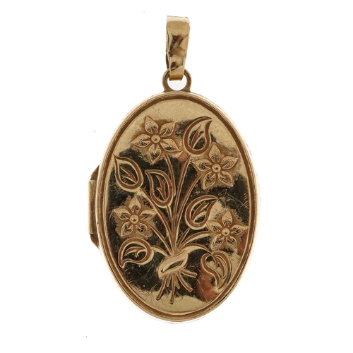 2154 - 9ct gold oval locket decorated with flowers, 3.4cm high, 3.1g