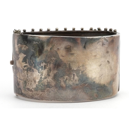 2060 - Large Victorian aesthetic buckle design bangle engraved with ivy leaves, Birmingham 1883, 6.6cm wide... 