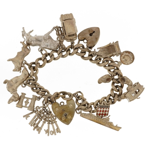 2077 - Silver charm bracelet with a selection of mostly silver charms including cruise ship, opening carava... 