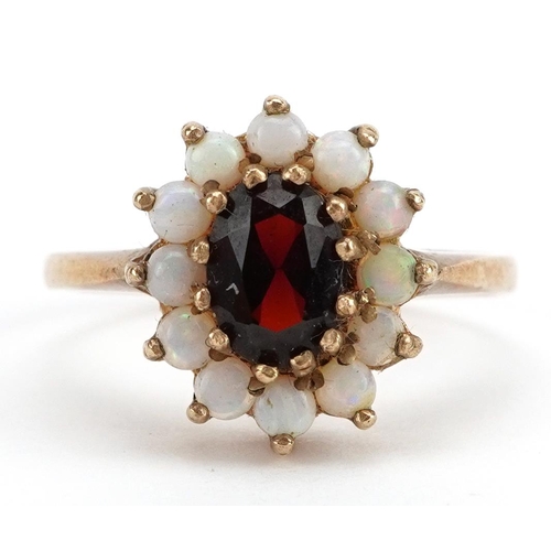 2115 - 9ct gold garnet and opal cluster ring, the garnet approximately 6.4mm x 4.7mm, size L, 2.4g
